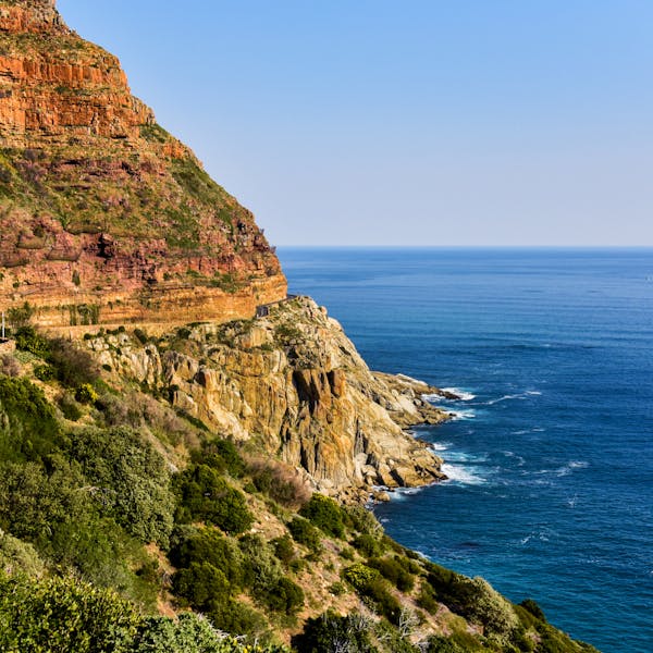 Beautiful coastal cliffs and ocean view in South Africa, showcasing nature's vibrant hues.